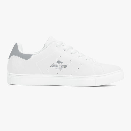 A white low-top sneaker with a gray heel tab and a gray 'SMALL STEP' logo printed on the side, shown in profile against a light gray background.