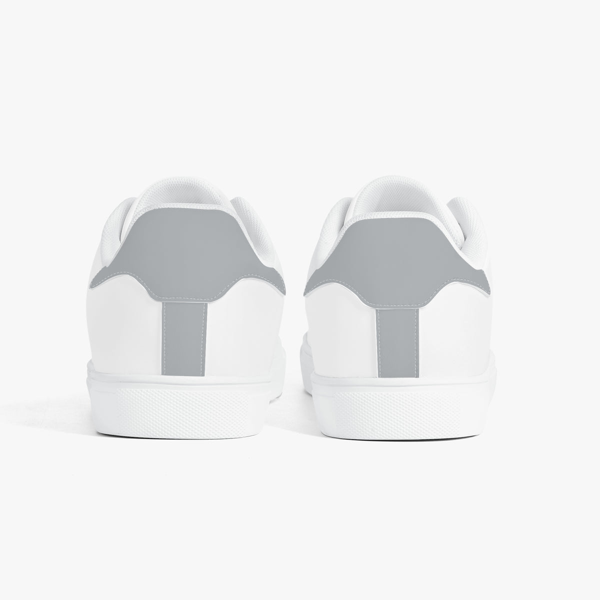 White sneakers with gray accents on a white background