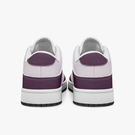 Rear view of plum and lilac sneakers displaying plum purple heel overlays, pale lilac collar panels, and two-tone white and black rubber outsoles.