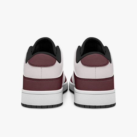 Rear view of burgundy and pale pink sneakers showing dark burgundy heel overlays, pale pink collar panels, and black interior collars above white midsoles.