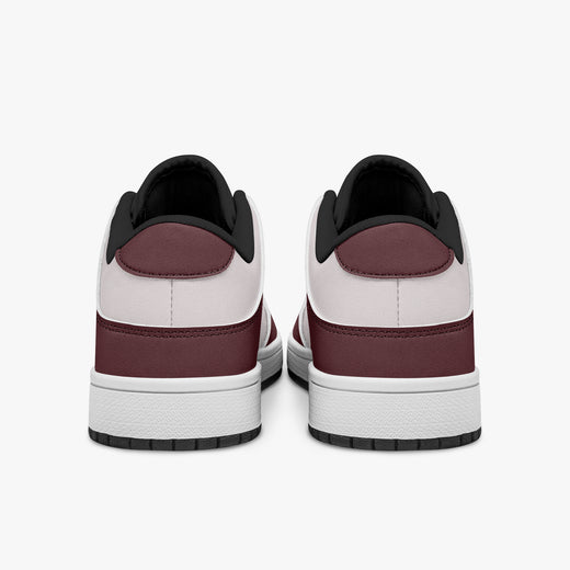 Rear view of burgundy and pale pink sneakers showing dark burgundy heel overlays, pale pink collar panels, and black interior collars above white midsoles.