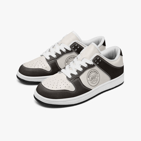 Angled three-quarter view of low-top sneakers in dark espresso brown and off-white leather, featuring a tiger emblem with "WALK WITH PURPOSE", white laces, and a white inner lining.