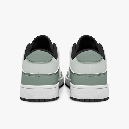 Rear view of sage green and off-white sneakers showing sage green heel overlays, off-white leather collars, and black interior collar lining above white midsoles.