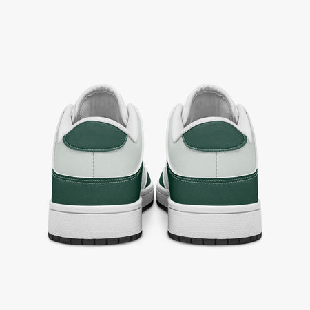 Rear view of forest green and white sneakers displaying dark green heel overlays, white leather collar panels, and two-tone white and black rubber outsoles.