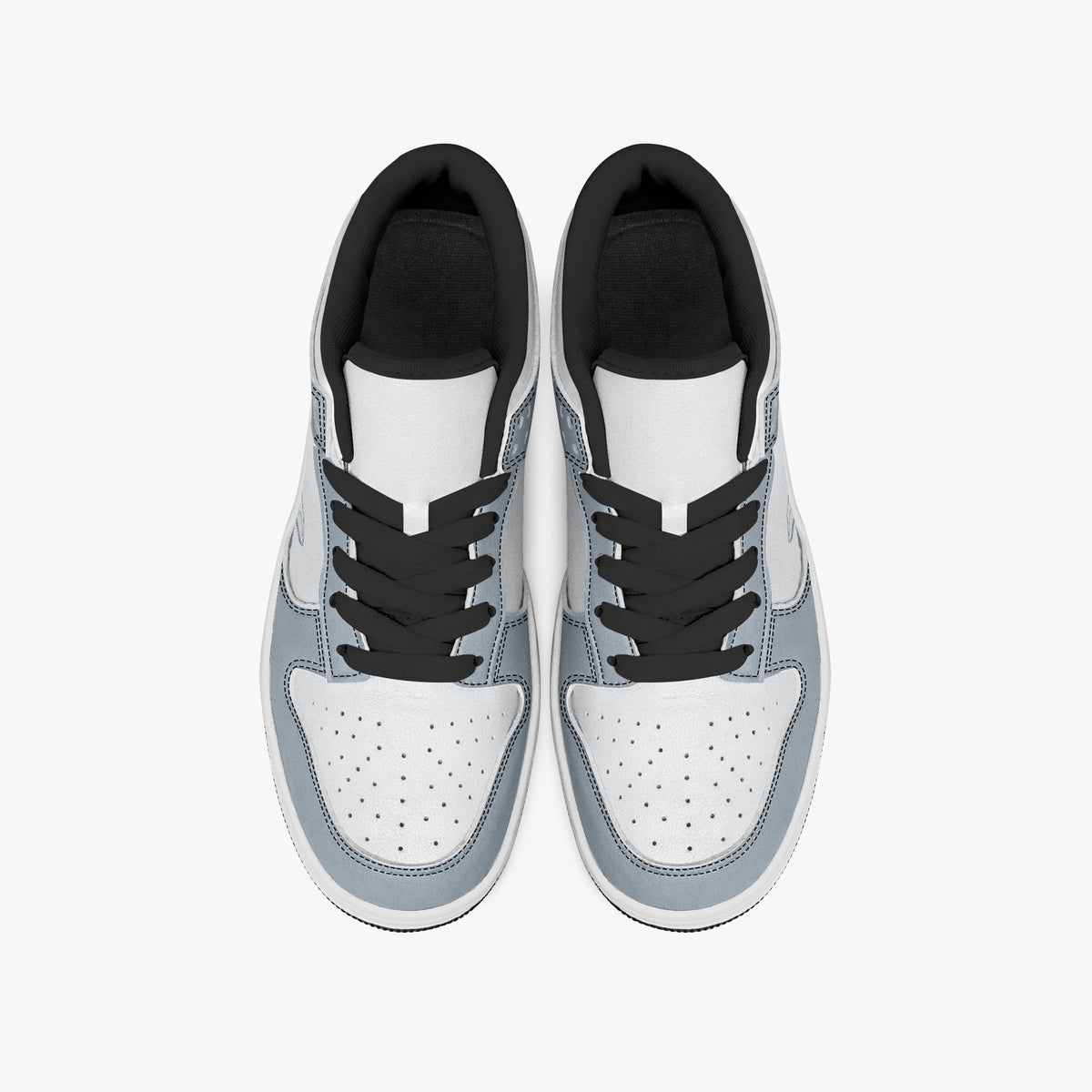 Overhead view of slate blue-grey and white sneakers displaying black laces, black padded collar lining, and perforated white leather toe boxes.
