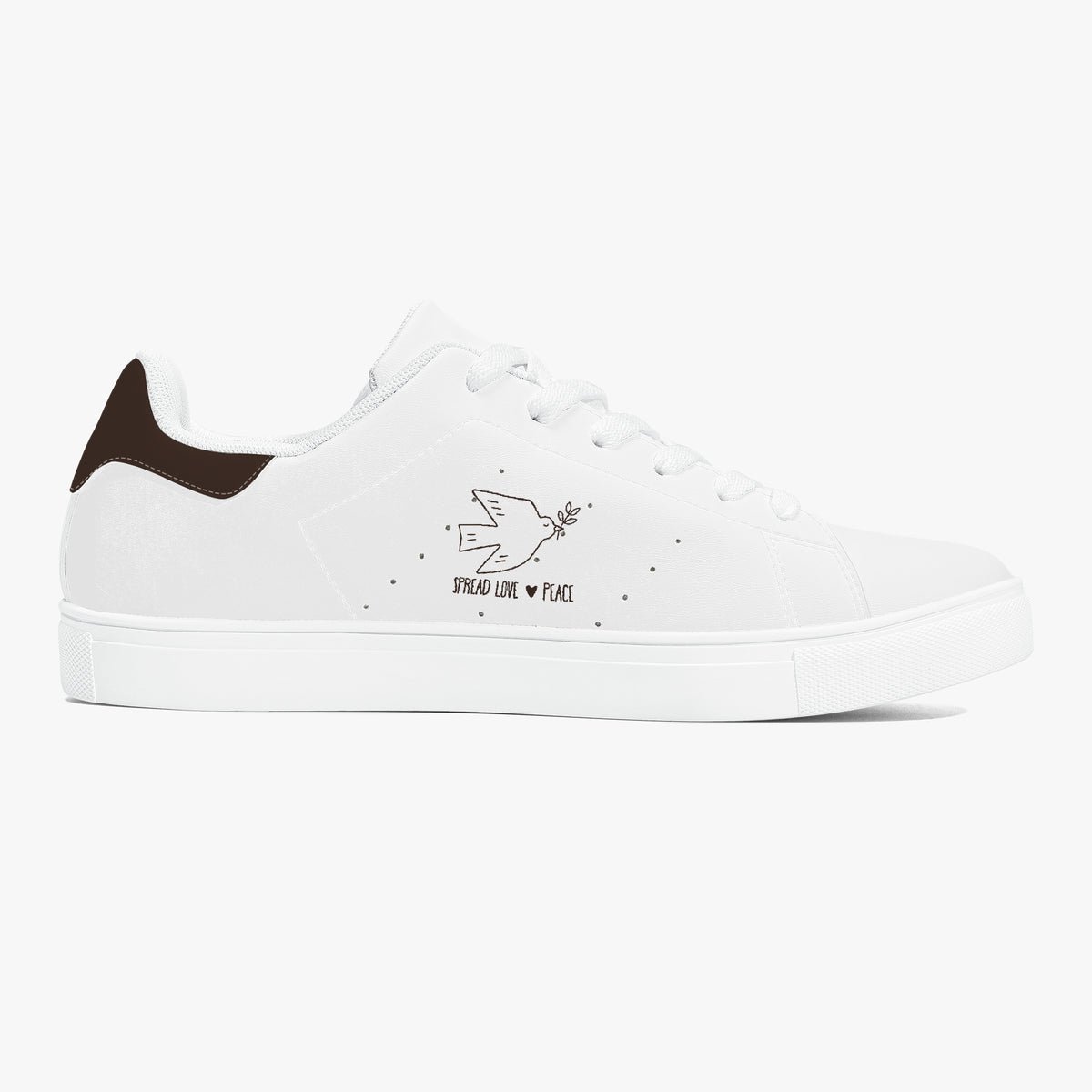 A white low-top sneaker with a dark brown heel tab, white laces, and a black graphic on the side depicting a bird, a heart, and the words 'PROUD LIKE PLACE'.
