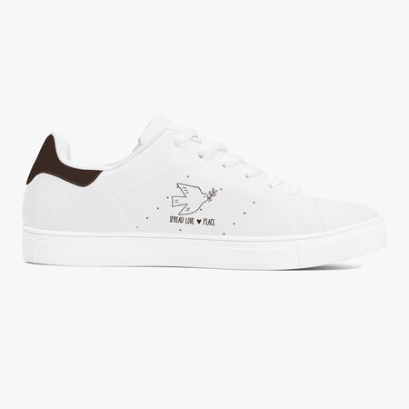 A white low-top sneaker with a dark brown heel tab, white laces, and a black graphic on the side depicting a bird, a heart, and the words 'PROUD LIKE PLACE'.