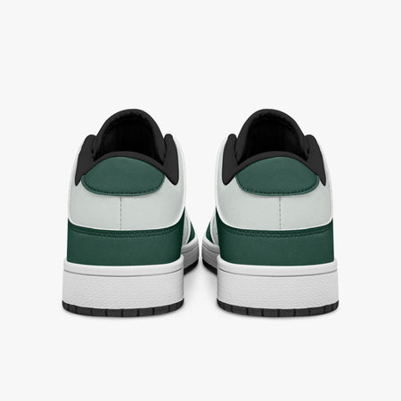 Rear view of forest green and white sneakers showing dark green heel overlays, white leather collars, and black interior collar lining above white midsoles.