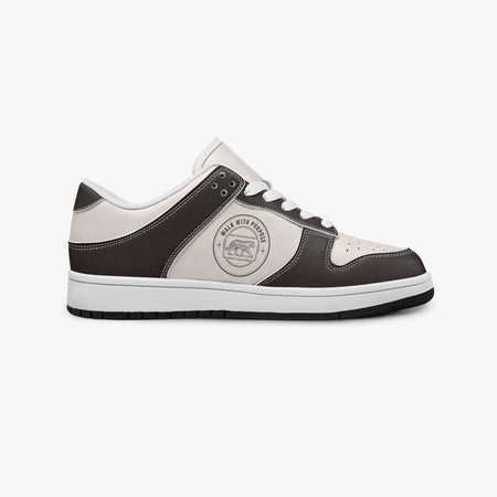 Side profile view of the right sneaker showcasing the dark brown leather overlays, tiger circular emblem, white eyelet lacing, and contrasting black outsole facing right.