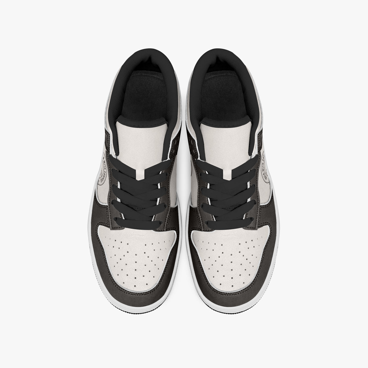 Overhead view of dark brown and cream sneakers displaying black laces, black padded collar lining, and perforated cream leather toe boxes.