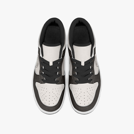 Overhead view of dark brown and cream sneakers displaying black laces, black padded collar lining, and perforated cream leather toe boxes.