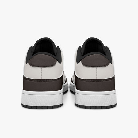 Rear view of dark brown and off-white sneakers showing dark brown heel overlays, off-white leather collars, and black interior collar lining above white midsoles.