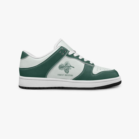Side profile view of the right sneaker showcasing the green leather overlays, pine branch emblem, white eyelet lacing, and contrasting black outsole facing right.