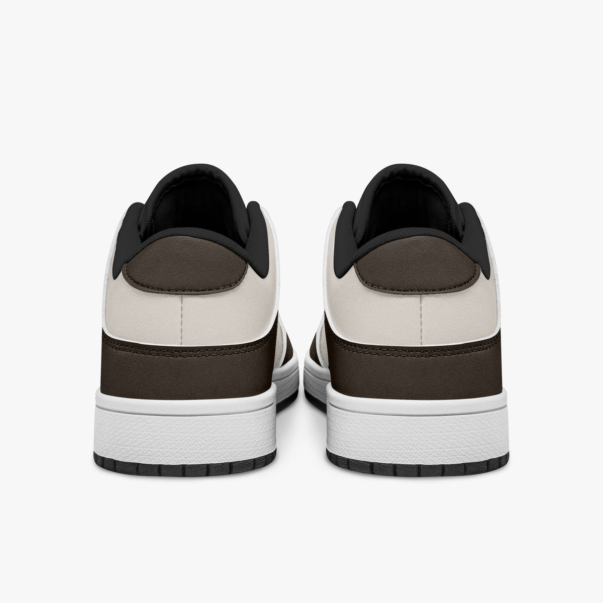 Rear view of dark brown and cream sneakers showing espresso brown heel overlays, off-white leather collar panels, and black interior collar lining above white midsoles.