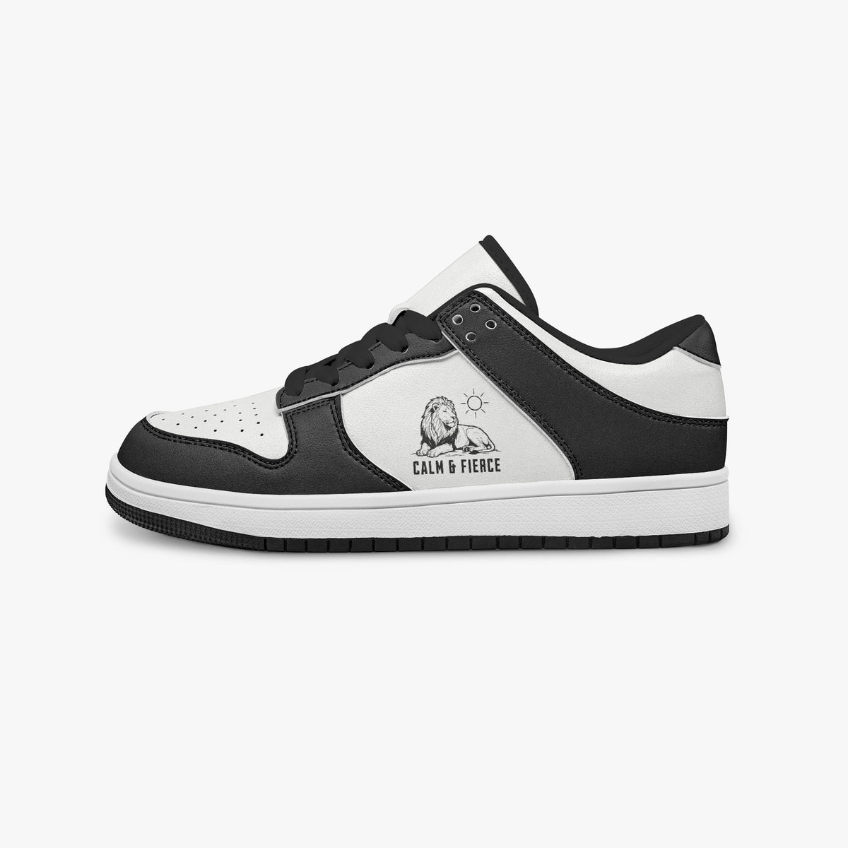 Side profile view of the left sneaker highlighting the black leather panels, lion emblem, black interior lining, and flat rubber sole facing right.