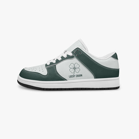 Side profile view of the left sneaker in dark green and white leather, highlighting the "LUCKY CHARM" clover design, white laces, white interior lining, and flat rubber sole facing right.
