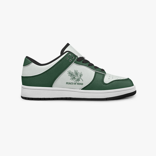 Side profile view of the right sneaker showcasing the forest green and white color blocking, "PEACE OF MIND" graphic, black laces, and black rubber outsole facing right.