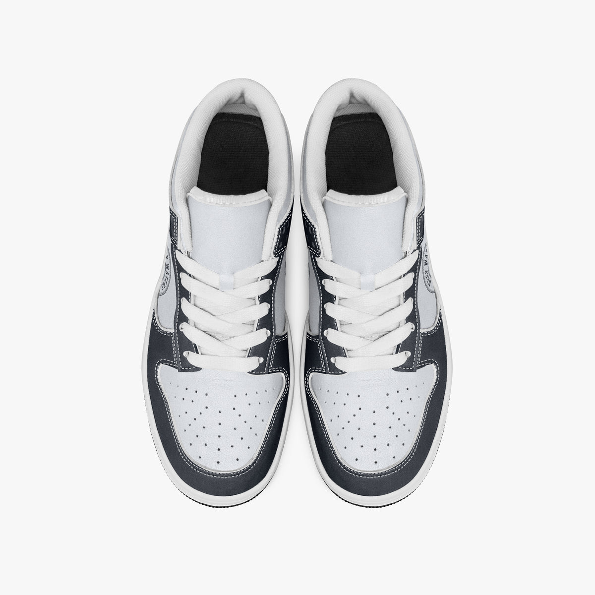 Overhead view of navy and white sneakers showing clean white laces, white padded collar lining, and perforated white leather toe boxes.