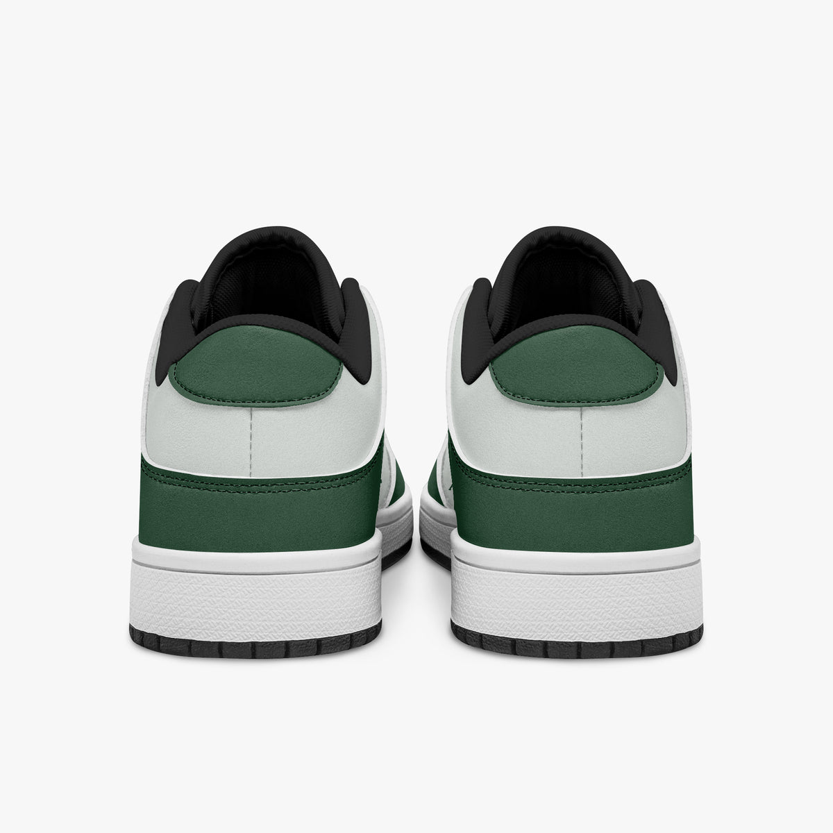 Rear view of forest green and white sneakers showing dark green heel overlays, white leather collars, and black interior collar lining above white midsoles.