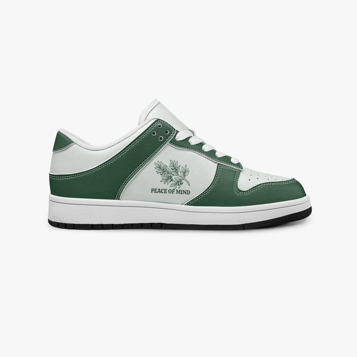Side profile view of the right sneaker showcasing the green leather overlays, branch emblem, white eyelet lacing, and contrasting black outsole facing right.