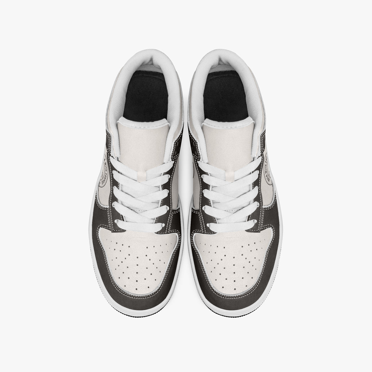 Overhead view of dark brown and cream sneakers showing clean white laces, white padded collar lining, and perforated cream leather toe boxes.