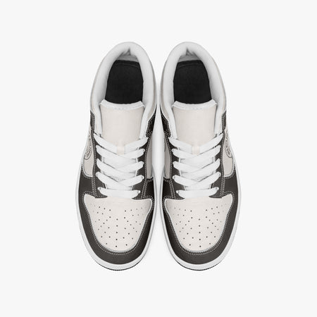 Overhead view of dark brown and cream sneakers showing clean white laces, white padded collar lining, and perforated cream leather toe boxes.