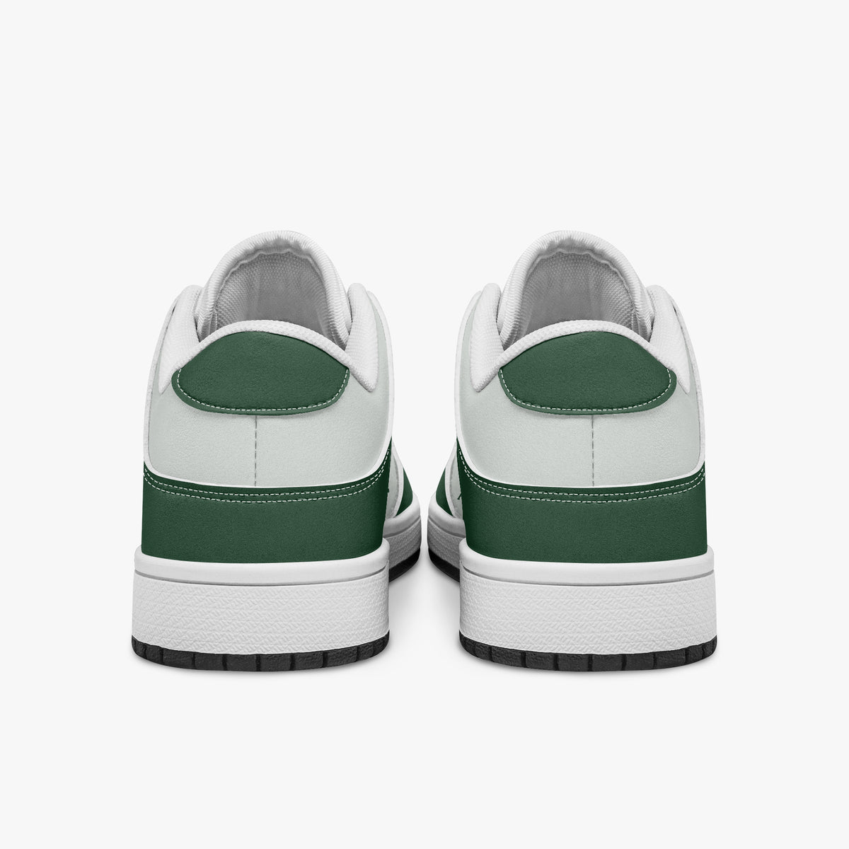 Rear view of forest green and white sneakers displaying dark green heel overlays, white leather collar panels, and two-tone white and black rubber outsoles.