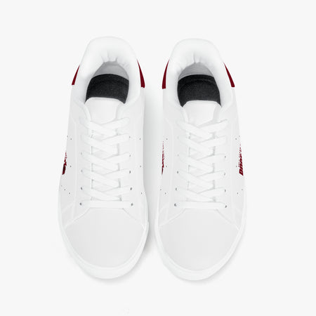 A pair of white low-top sneakers shown from a top-down view on a clean white background. The sneakers feature white laces, white leather or synthetic uppers, black inner lining, and small red accents on the heel and side.