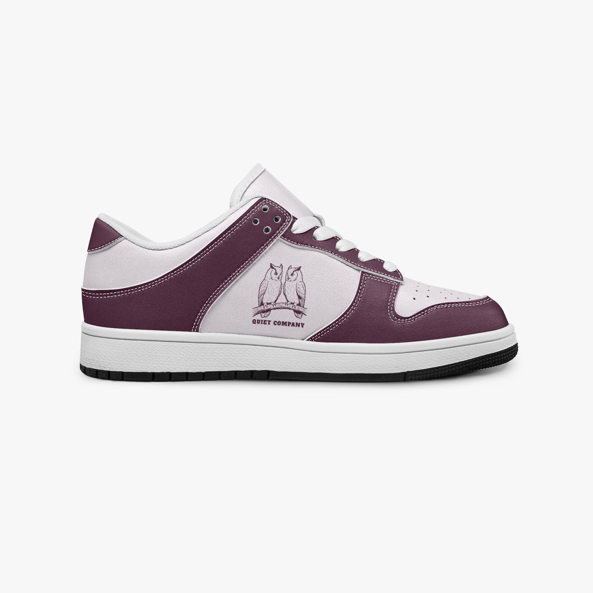 Side profile view of the right sneaker showcasing the burgundy leather overlays, owl emblem, white eyelet lacing, and contrasting black outsole facing right.
