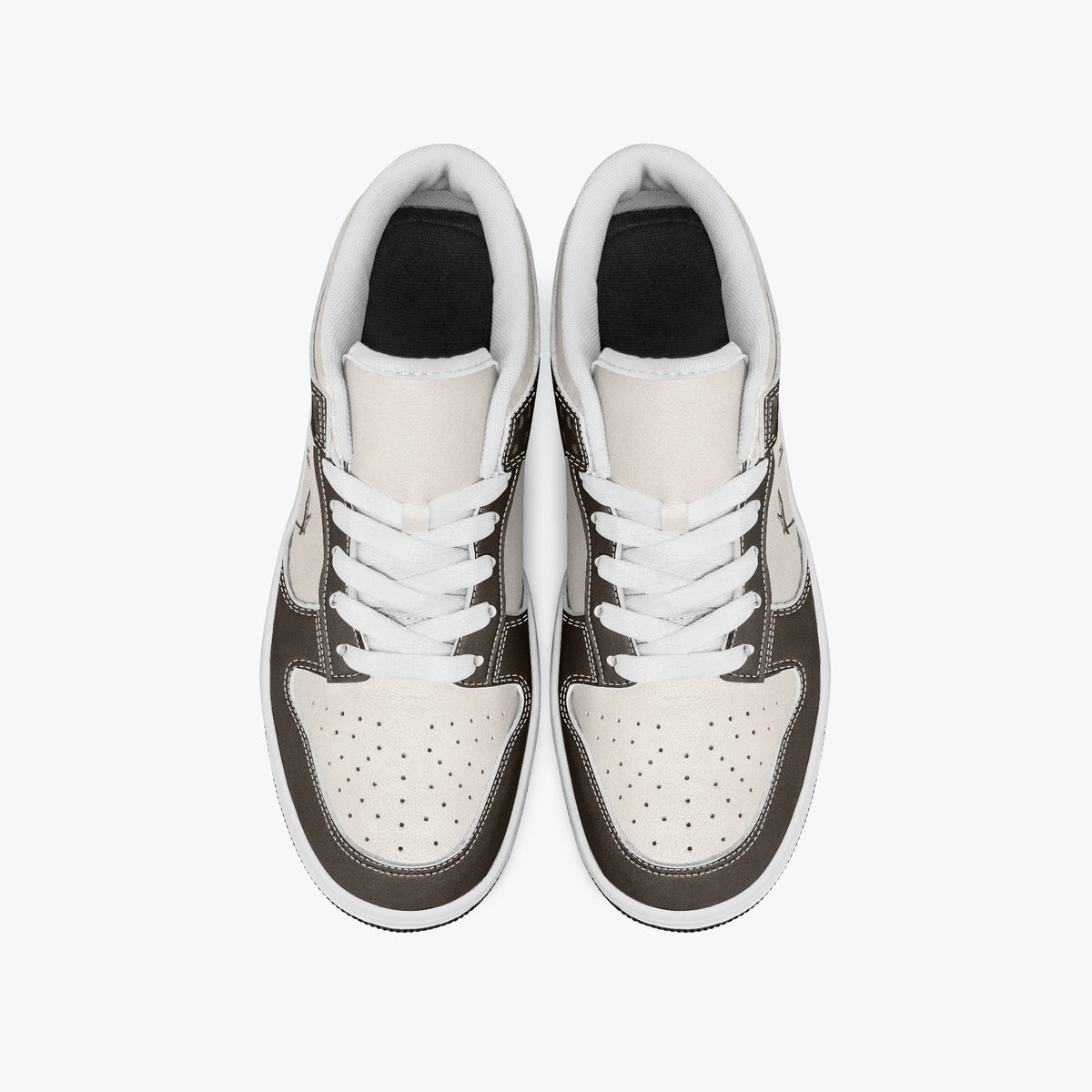 Overhead view of dark brown and cream sneakers showing clean white laces, white padded collar lining, and perforated cream leather toe boxes.