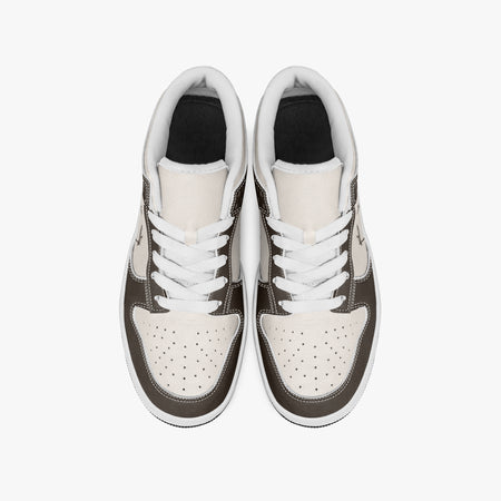 Overhead view of dark brown and cream sneakers showing clean white laces, white padded collar lining, and perforated cream leather toe boxes.