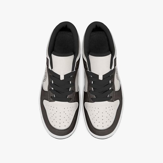 Overhead view of dark brown and cream sneakers displaying black laces, black padded collar lining, and perforated cream leather toe boxes.
