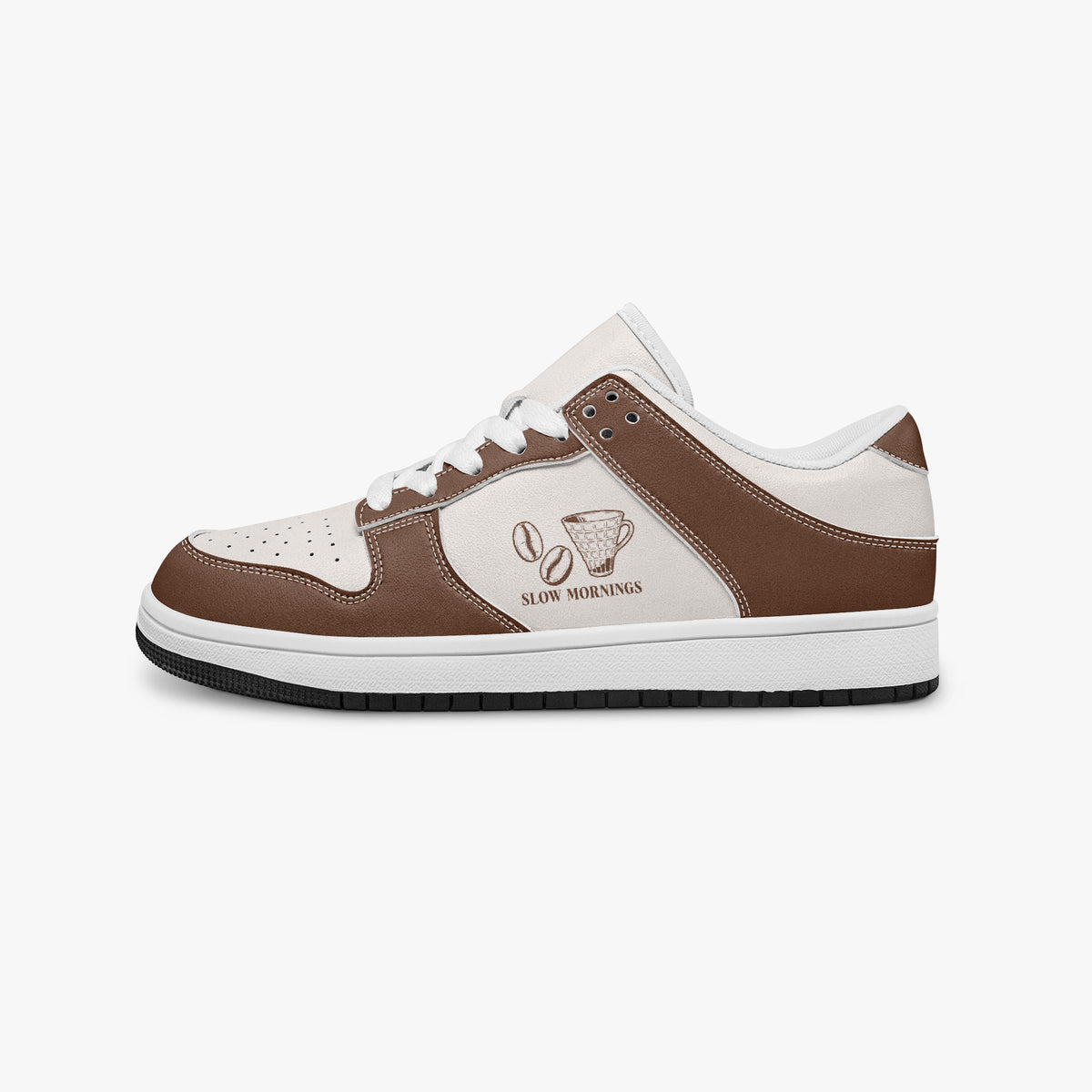 Side profile view of the left sneaker in brown and off-white leather, highlighting the "SLOW MORNINGS" coffee graphic, white laces, white interior lining, and flat rubber sole facing right.