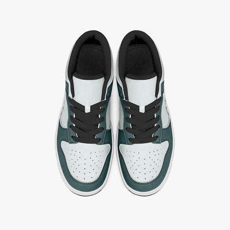 Overhead view of dark teal and white sneakers showing the black laces, perforated toe boxes, padded collars, and white leather uppers.