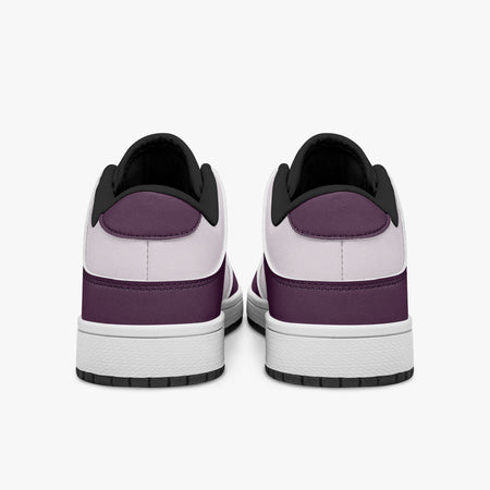 Rear view of plum and lilac sneakers displaying purple heel overlays, pale lilac collar panels, and two-tone white and black rubber outsoles.
