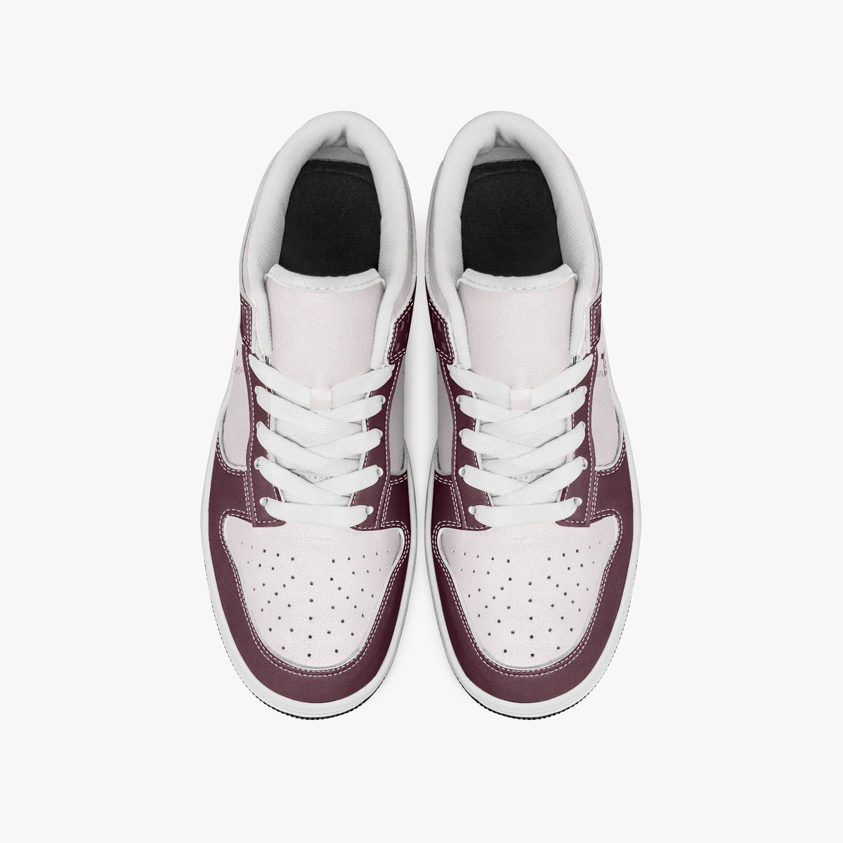 Overhead view of burgundy and pale pink sneakers showing clean white laces, white padded collar lining, and perforated pale pink toe boxes.