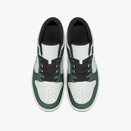 Overhead view of forest green and white sneakers displaying black laces, black padded collar lining, and perforated white leather toe boxes.