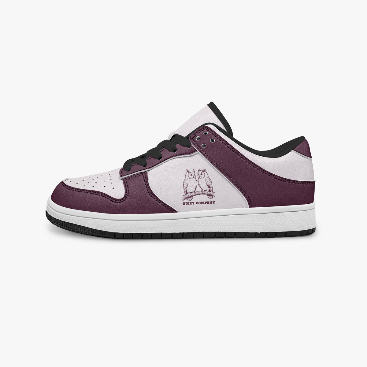 Side profile view of the left sneaker highlighting the burgundy leather panels, owl emblem, black interior lining, and flat rubber sole facing right.
