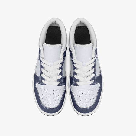 Overhead view of navy blue and white sneakers showing clean white laces, white padded collar lining, and perforated white leather toe boxes.