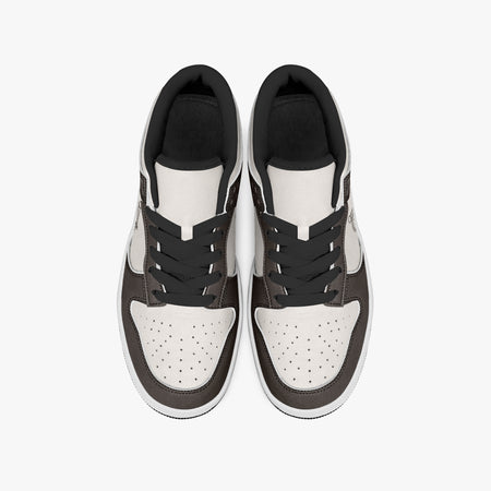 Overhead view of brown and cream sneakers displaying black laces, black padded collar lining, and perforated cream leather toe boxes.