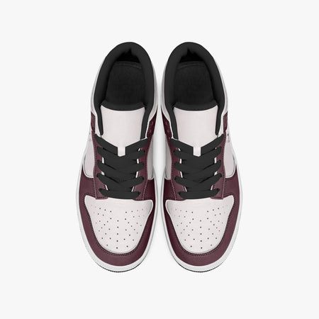 Overhead view of burgundy and pale pink sneakers displaying black laces, black padded collar lining, and perforated pale pink leather toe boxes.