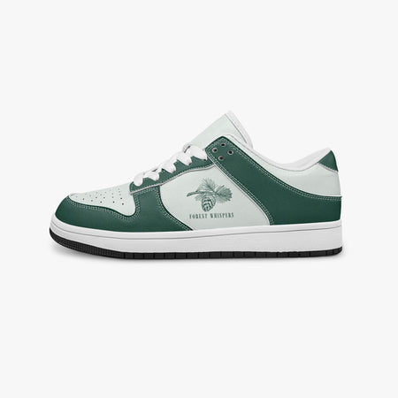 Side profile view of the left sneaker in forest green and white leather, highlighting the "FOREST WHISPERS" pine cone graphic, white laces, white interior lining, and flat rubber sole facing right.