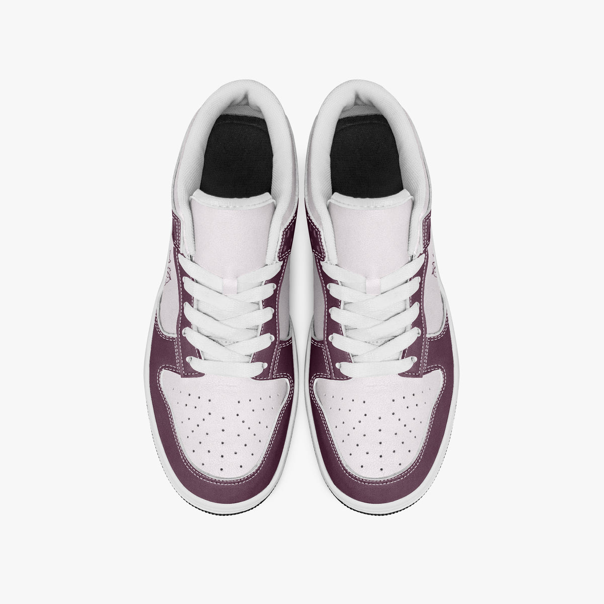 Overhead view of burgundy and pale pink sneakers showing clean white laces, white padded collar lining, and perforated pale pink toe boxes.