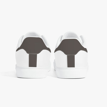 White sneakers with 'Emotionally tired.' text on a white background