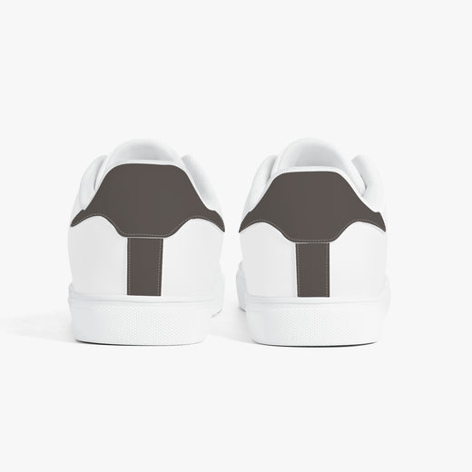 White sneakers with 'Emotionally tired.' text on a white background
