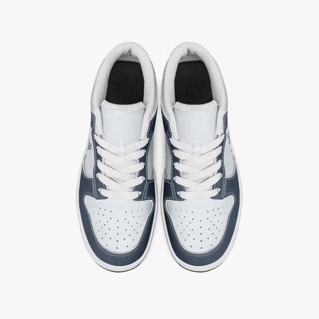 Overhead view of navy blue and white sneakers showing white laces, white padded collars, perforated toe boxes, and white leather uppers.