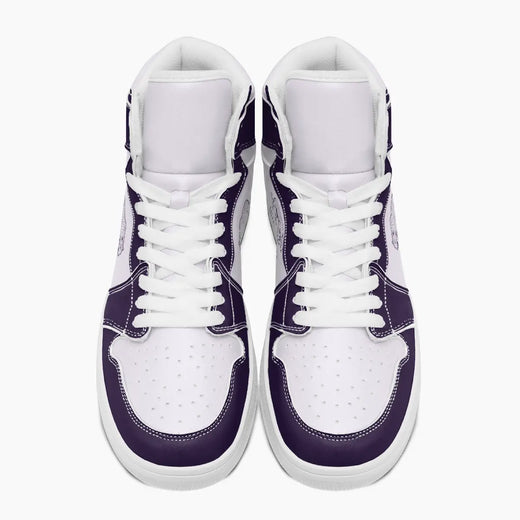 Overhead top-down view of high-top sneakers highlighting deep purple eyestays, white lacing, and perforated white leather vamps.