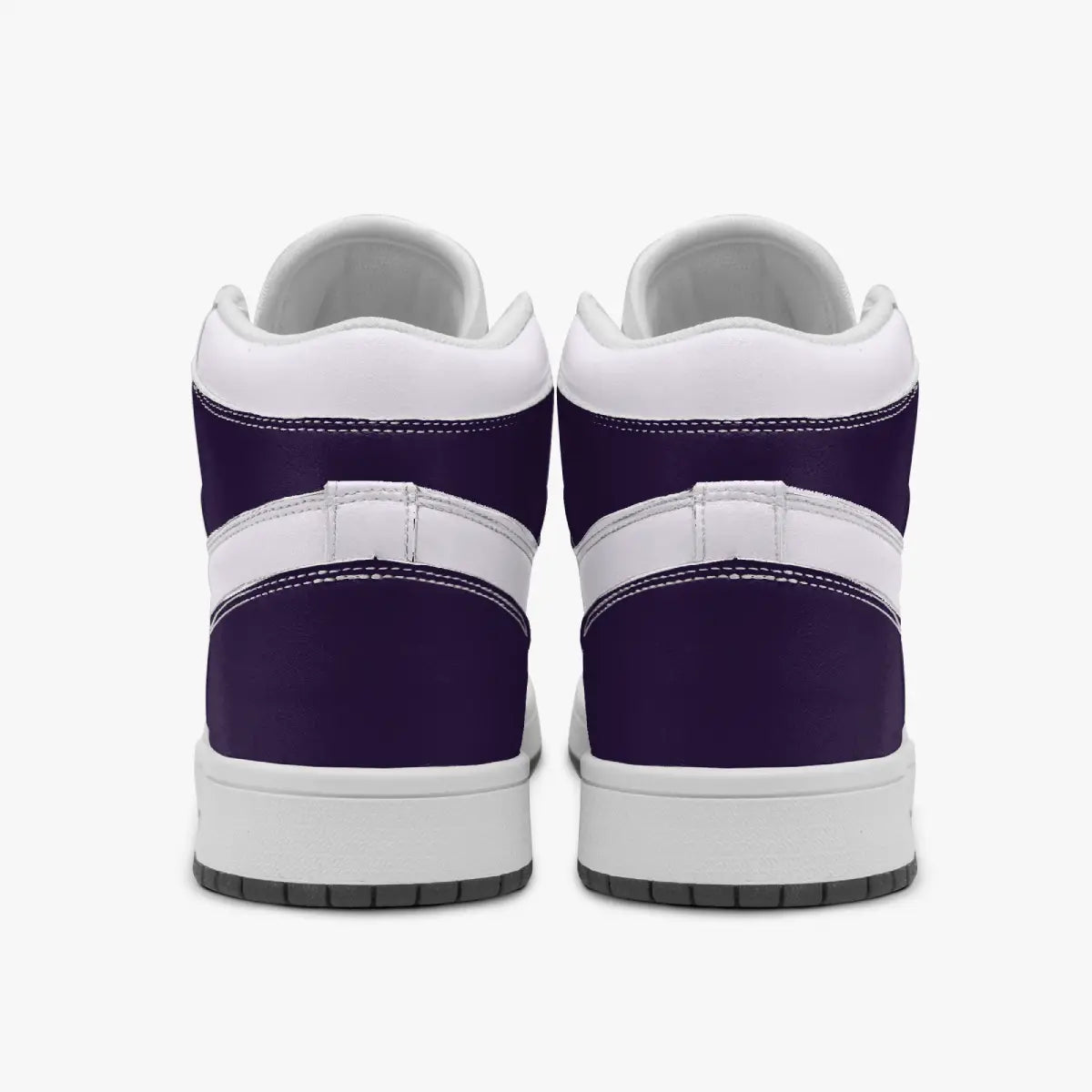 Rear view of purple and white high-top sneakers displaying dark purple heel counters, white collar panels, and clean white rubber midsoles above dark outsoles.
