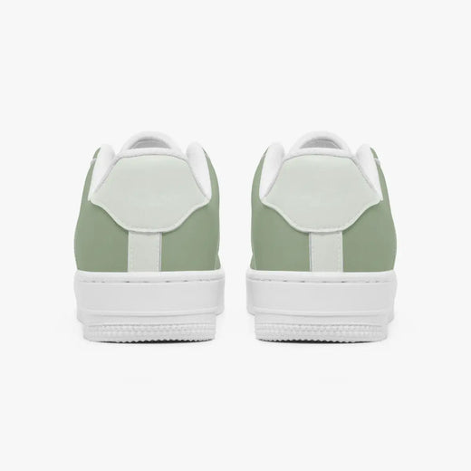 Rear view of sage green and mint sneakers displaying sage green heel overlays, light mint leather collar tabs, and textured white rubber platform midsoles.