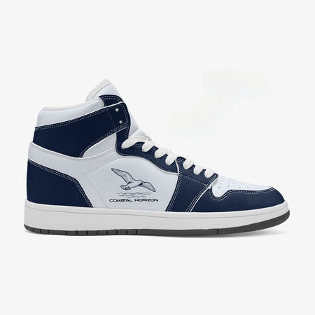 Alternative side profile view of the right high-top sneaker showcasing deep navy leather overlays, coastal bird artwork, white eyelet lacing, and matching white midsole facing right.